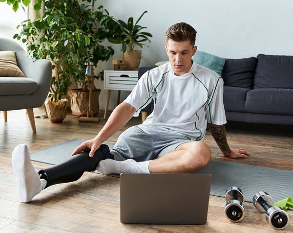 man viewing online fitness program