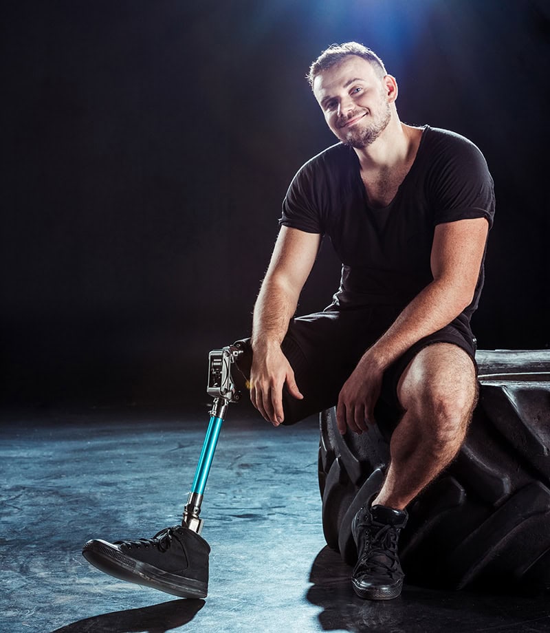 amputee sitting on a tire