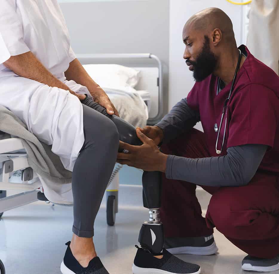 Dr. with patient looking at prosthetic
